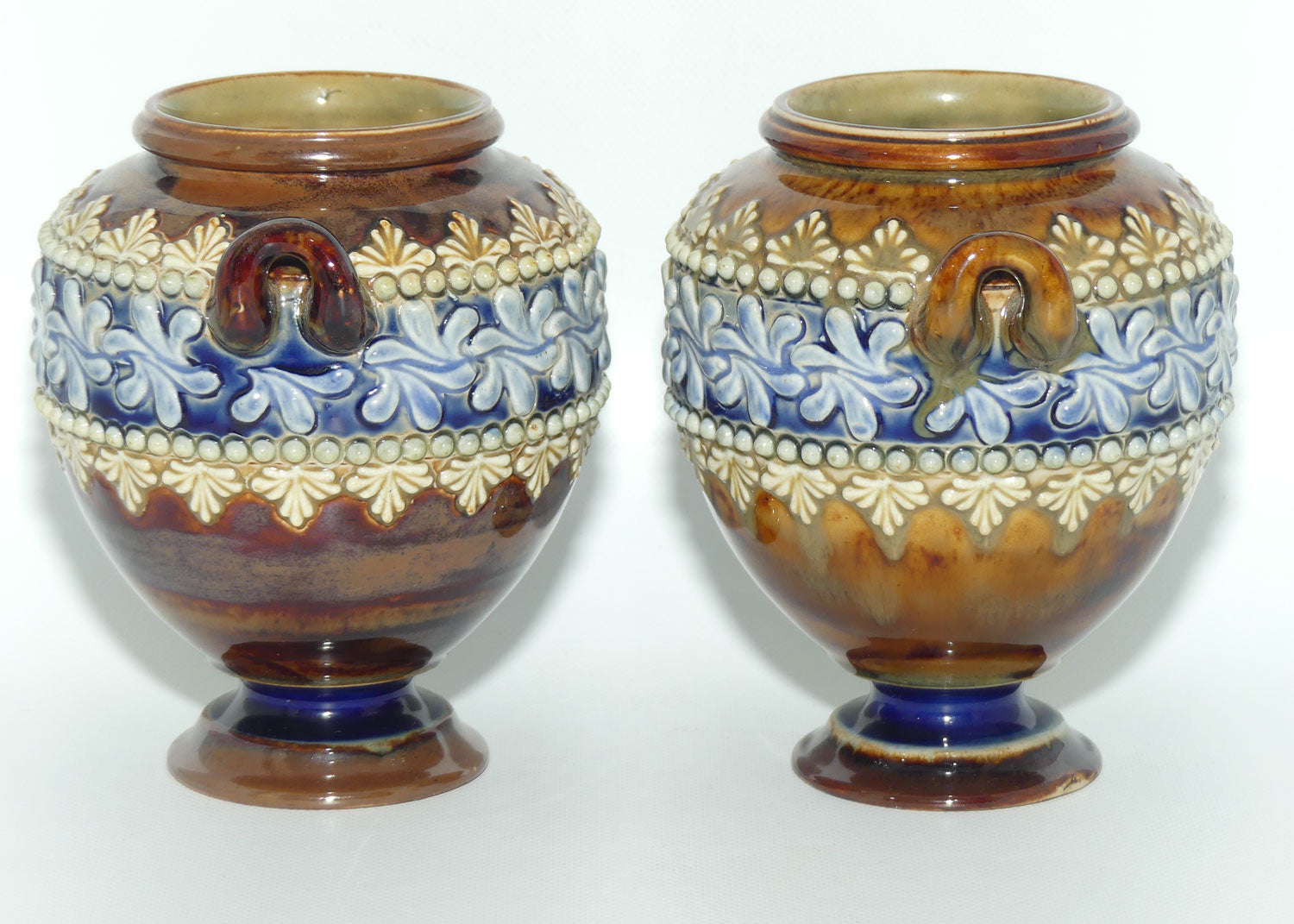 Doulton Lambeth stoneware pair of handled and footed urns (#4505)