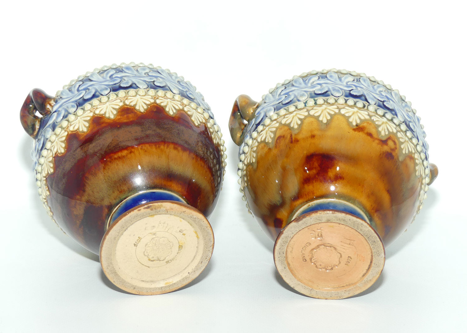 Doulton Lambeth stoneware pair of handled and footed urns (#4505)