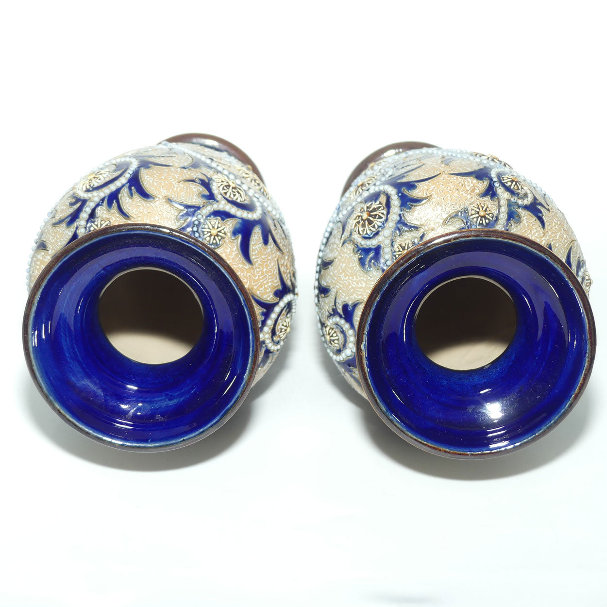 Royal Doulton stoneware George Tinworth pair of bulbous centrepiece vases with applied baguette beads and foliage