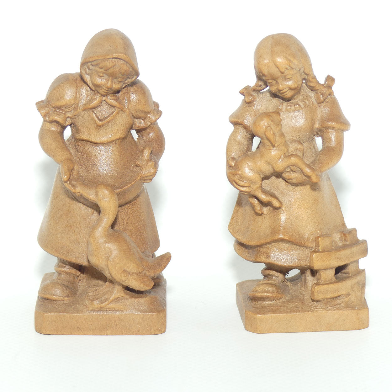 Pair of Wooden finely carved figures of Farm girls | Swiss | by Walter Stahli