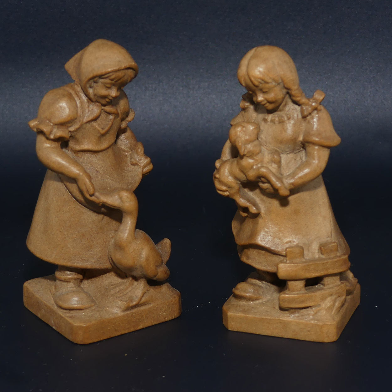 Pair of Wooden finely carved figures of Farm girls | Swiss | by Walter Stahli