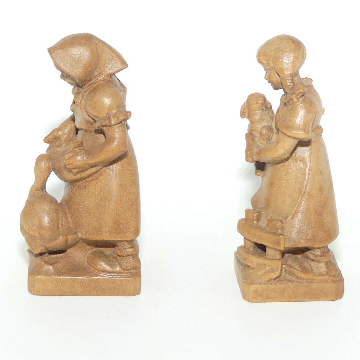 Pair of Wooden finely carved figures of Farm girls | Swiss | by Walter Stahli