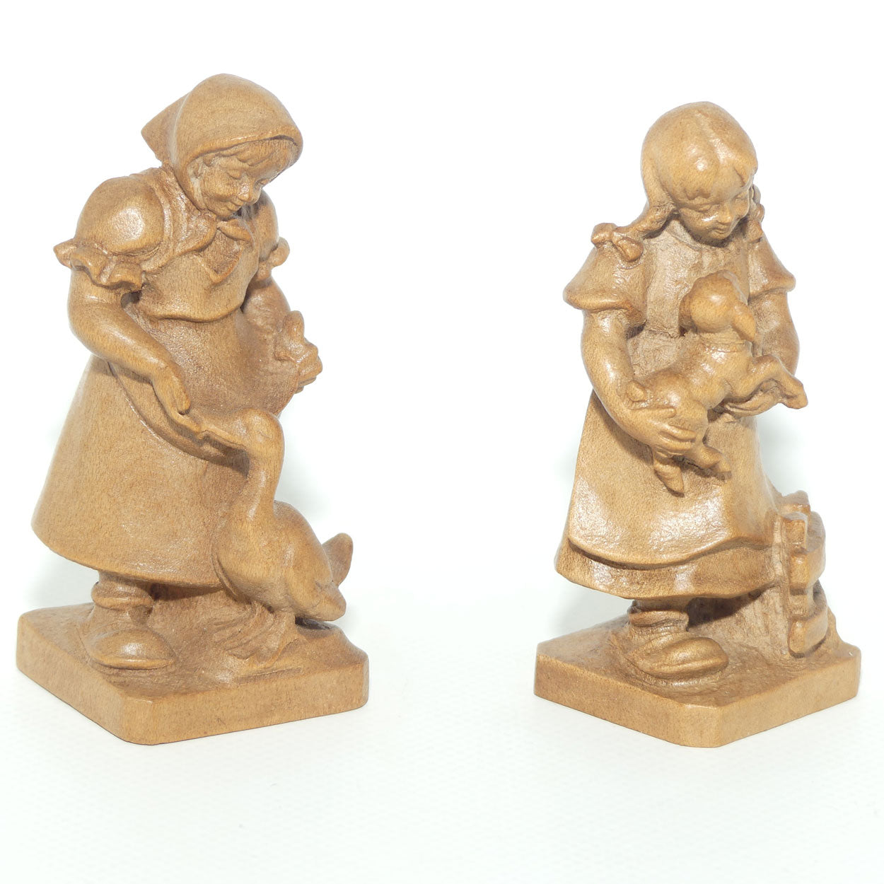 Pair of Wooden finely carved figures of Farm girls | Swiss | by Walter Stahli