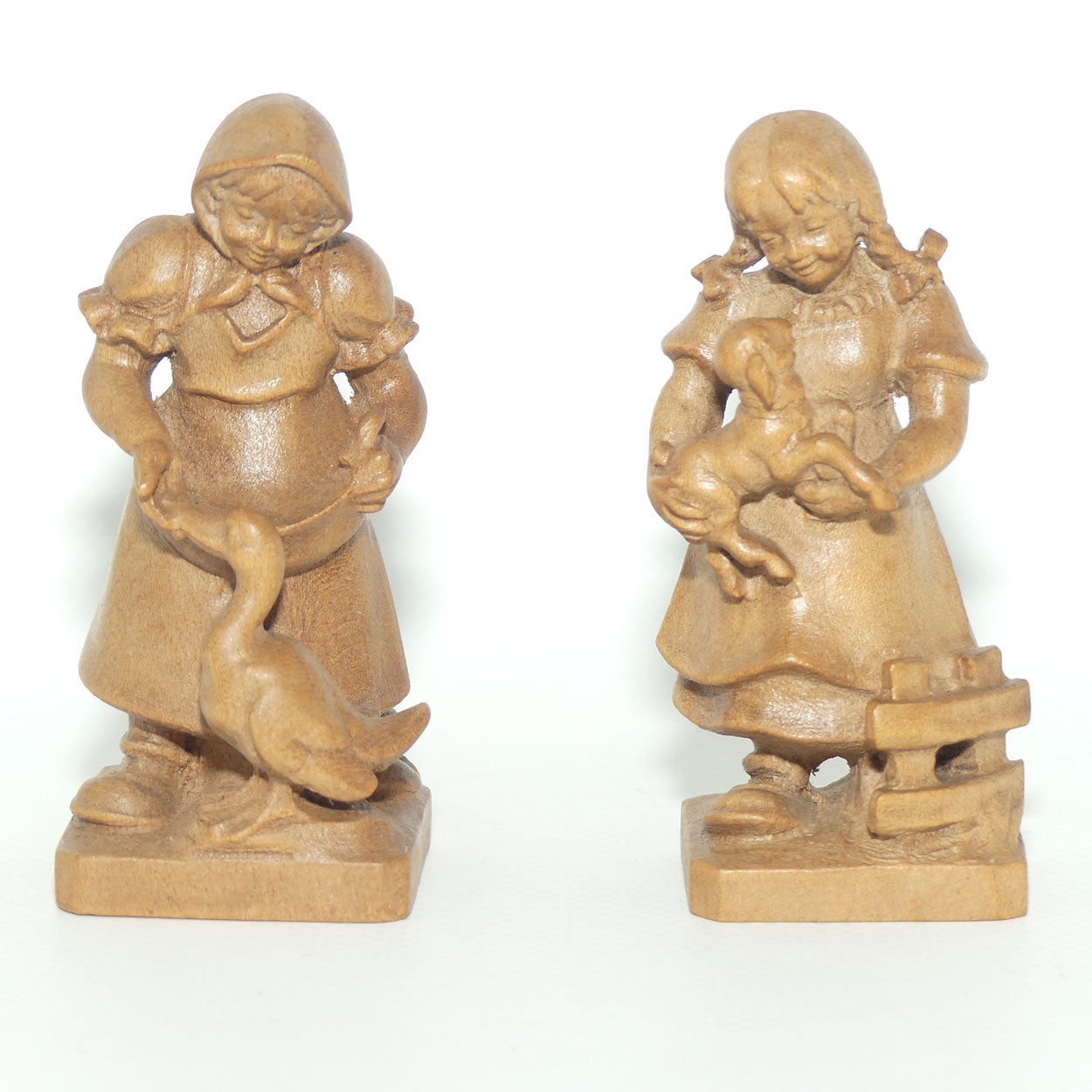Pair of Wooden finely carved figures of Farm girls | Swiss | by Walter Stahli