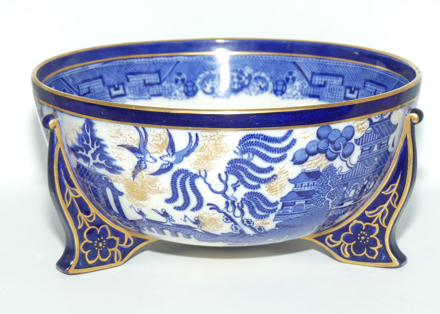 Doulton Burslem England Flow Blue Willow bowl on figured feet | unmarked