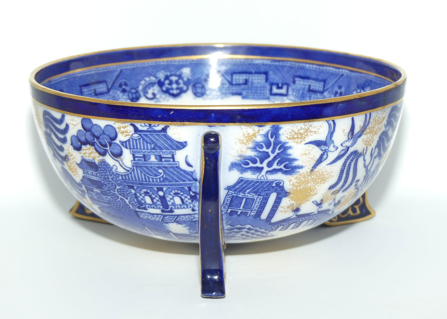Doulton Burslem England Flow Blue Willow bowl on figured feet | unmarked