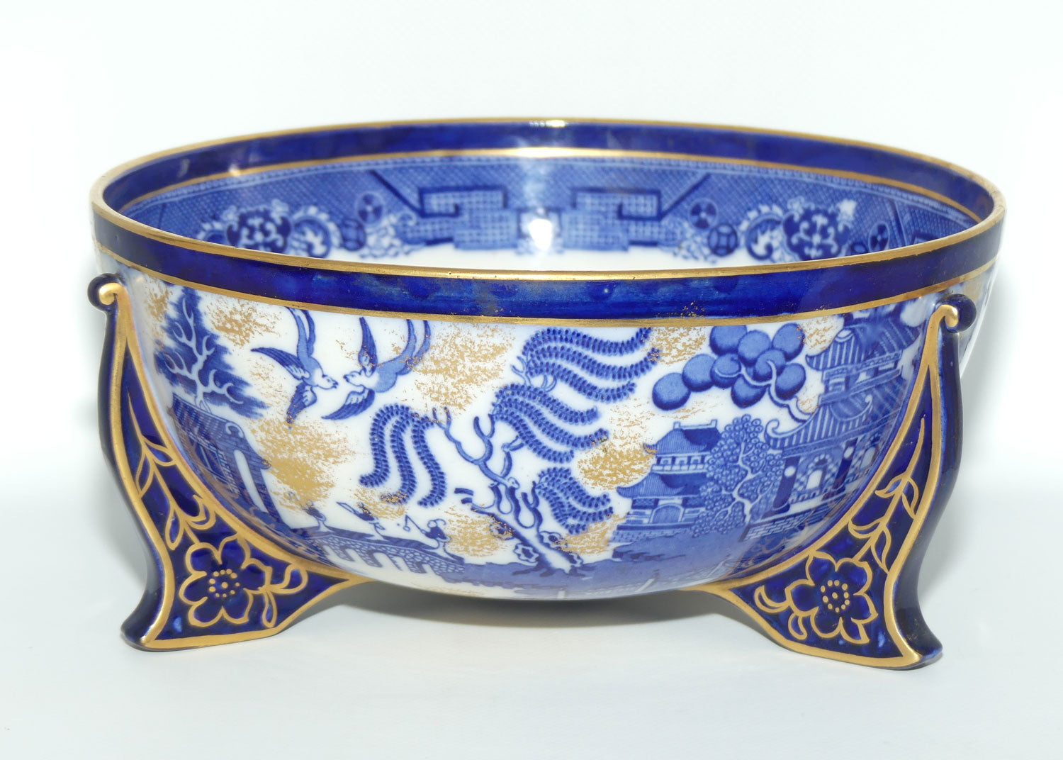 Doulton Burslem England Flow Blue Willow bowl on figured feet | unmarked