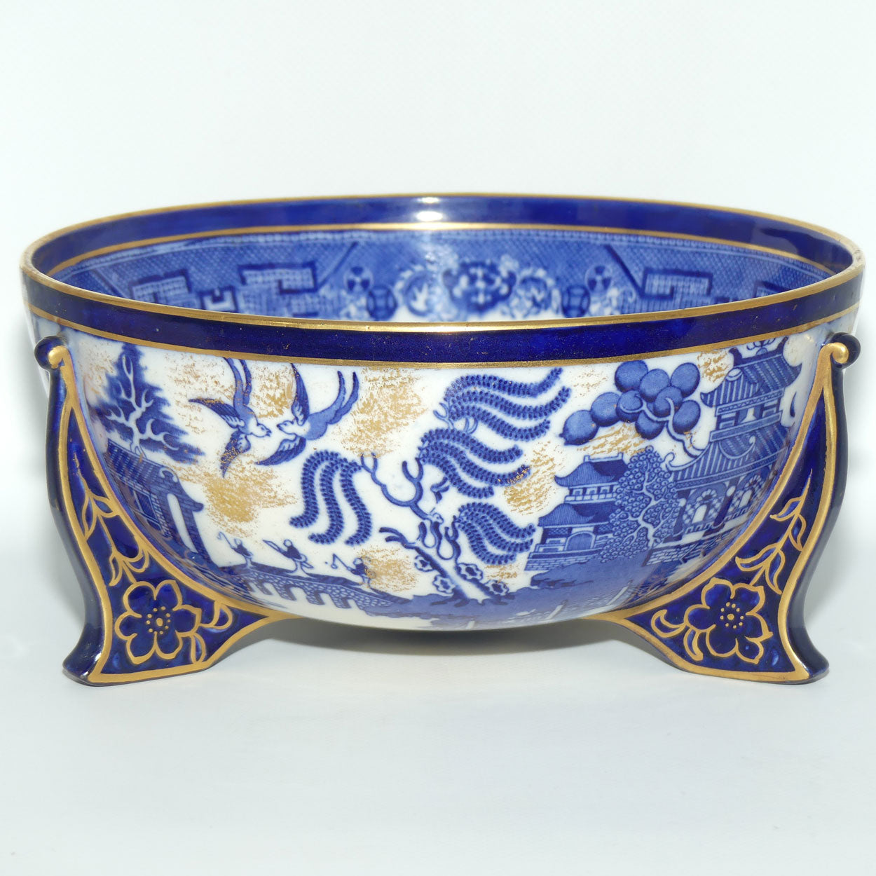 Doulton Burslem England Flow Blue Willow bowl on figured feet | unmarked