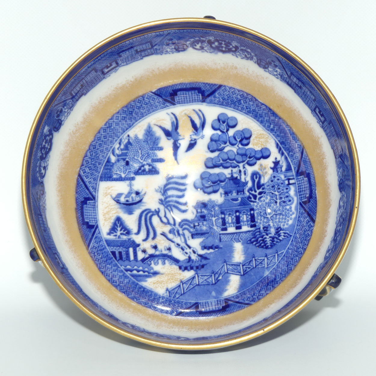 Doulton Burslem England Flow Blue Willow bowl on figured feet | unmarked