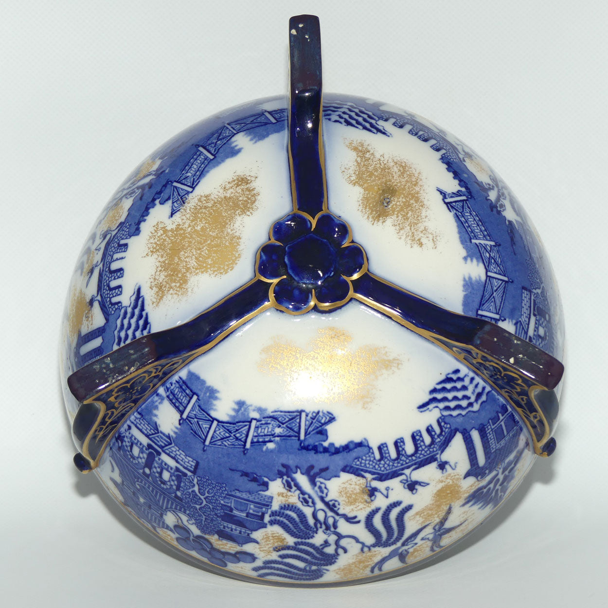 Doulton Burslem England Flow Blue Willow bowl on figured feet | unmarked