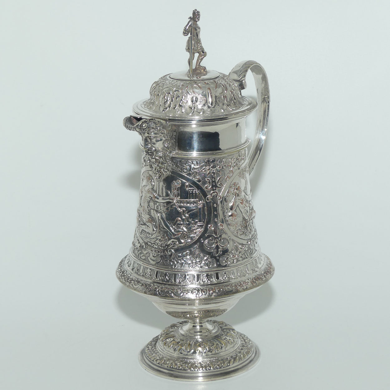 John Grinsell and Sons Silver Plate Heavily decorated Wine Jug with motto Patientia Solertia Nolvi