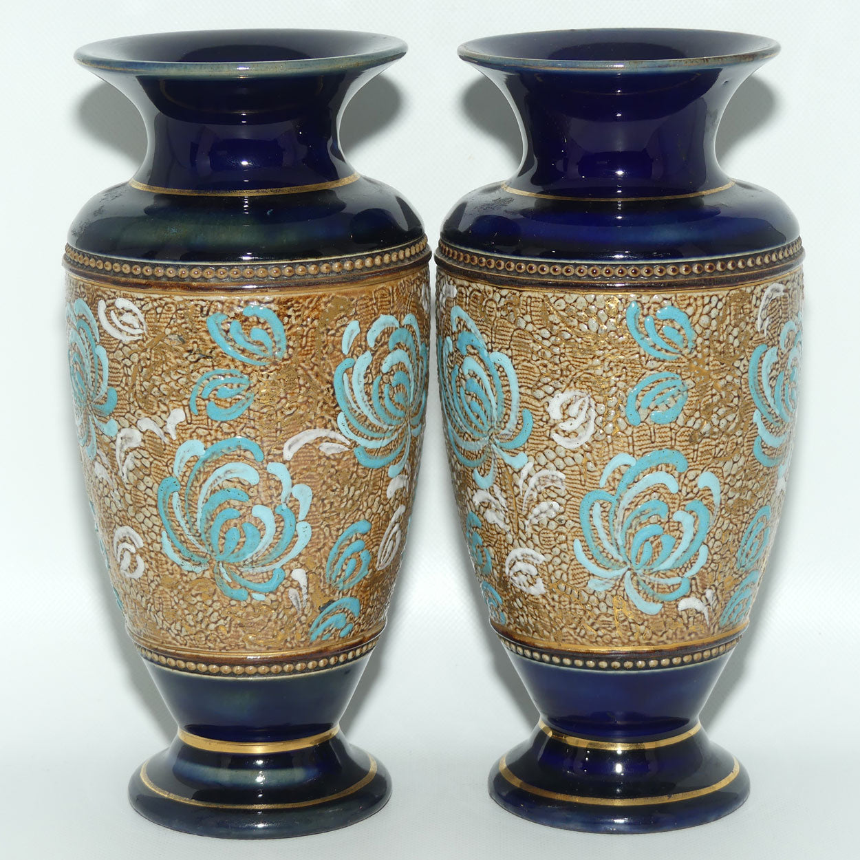 Royal Doulton pair of small stoneware vases with blue & white enamelled flowers & gilt highlights (X5564)