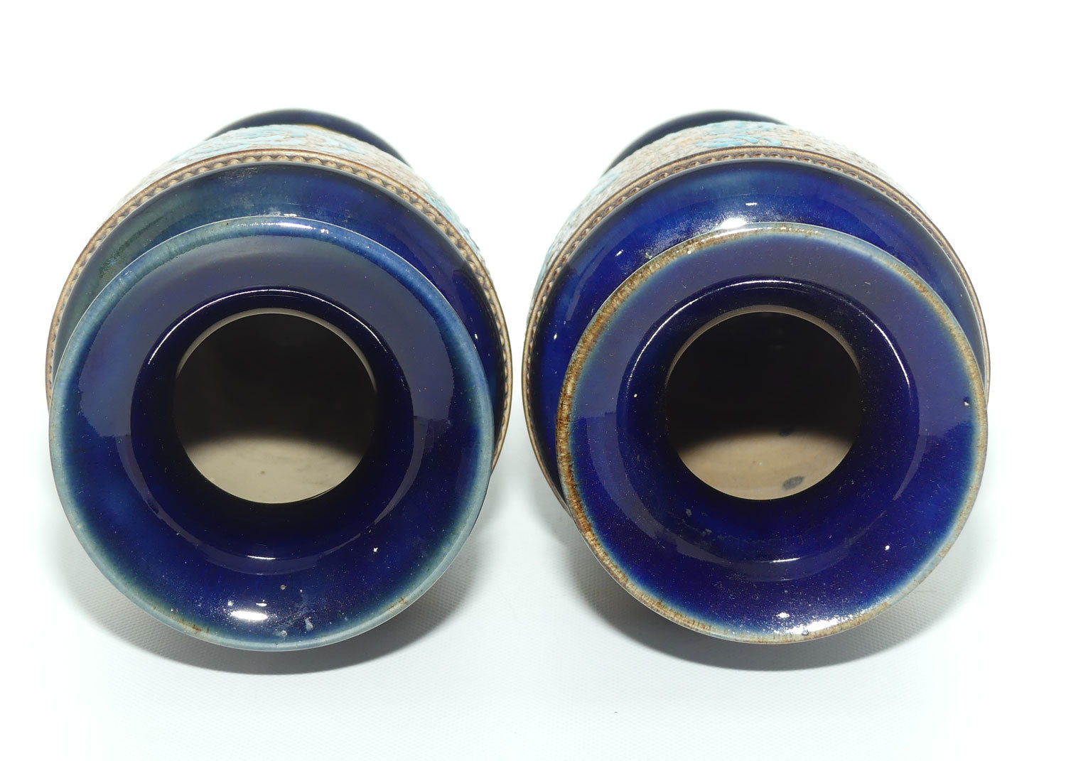 Royal Doulton pair of small stoneware vases with blue & white enamelled flowers & gilt highlights (X5564)