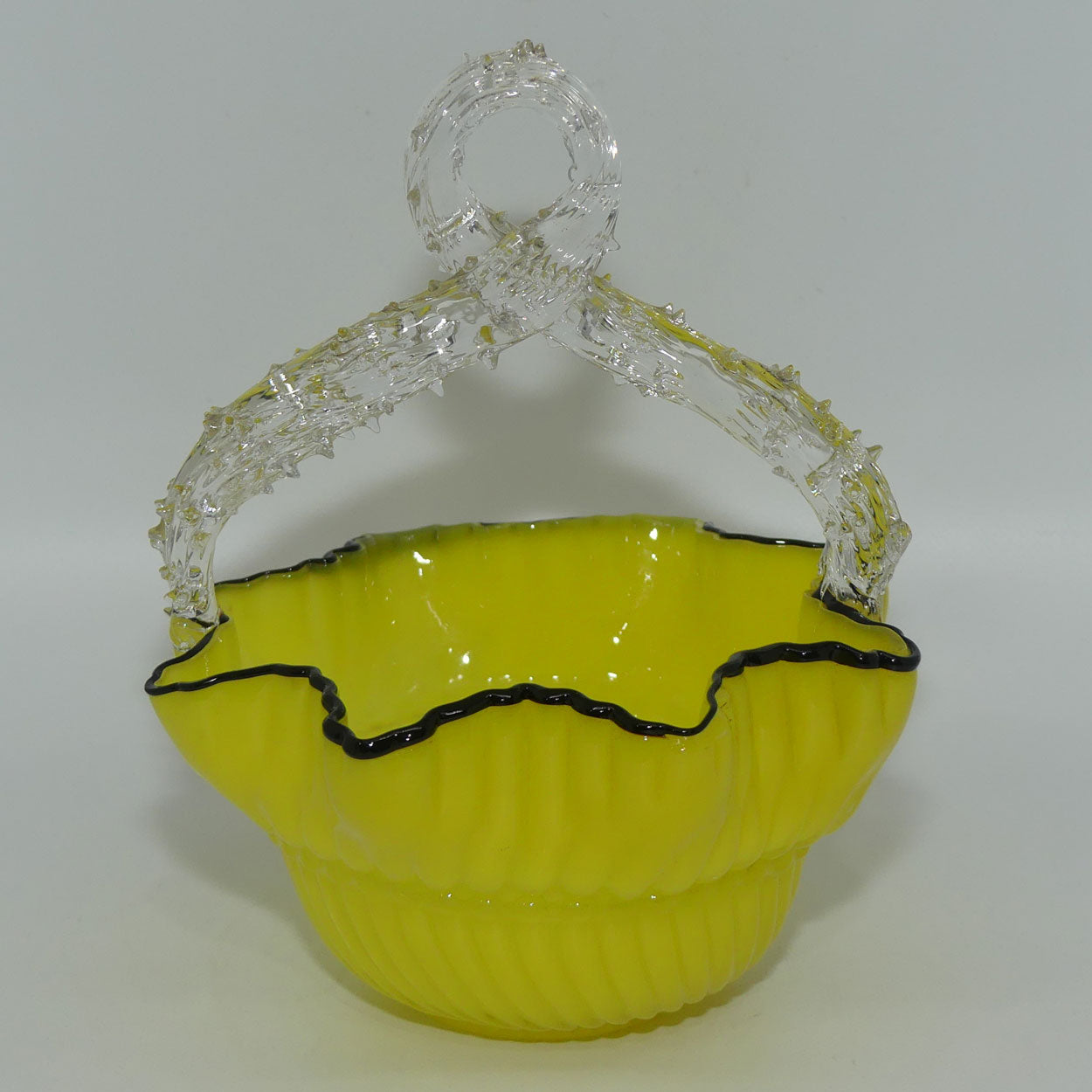 yellow-glass-with-black-edge-thorn-handle-basket