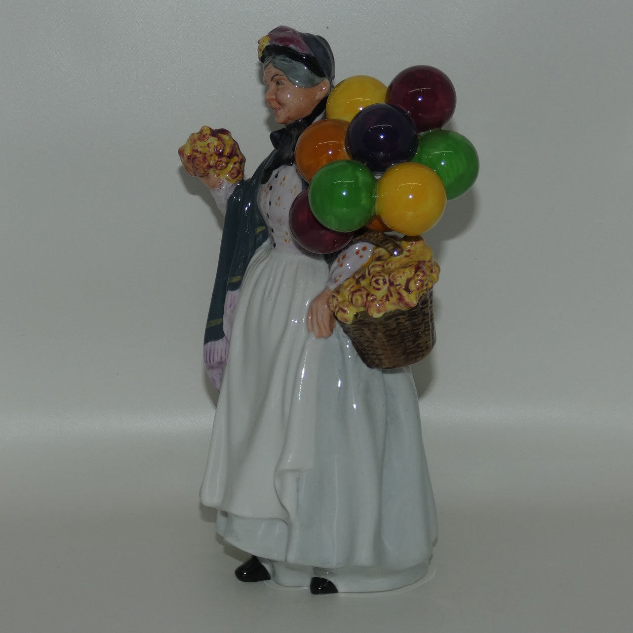 HN1843 Royal Doulton figure Biddy Penny Farthing | later stamp