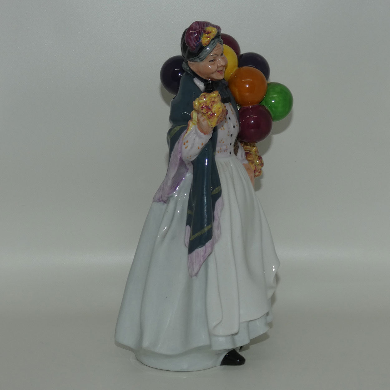 HN1843 Royal Doulton figure Biddy Penny Farthing | later stamp