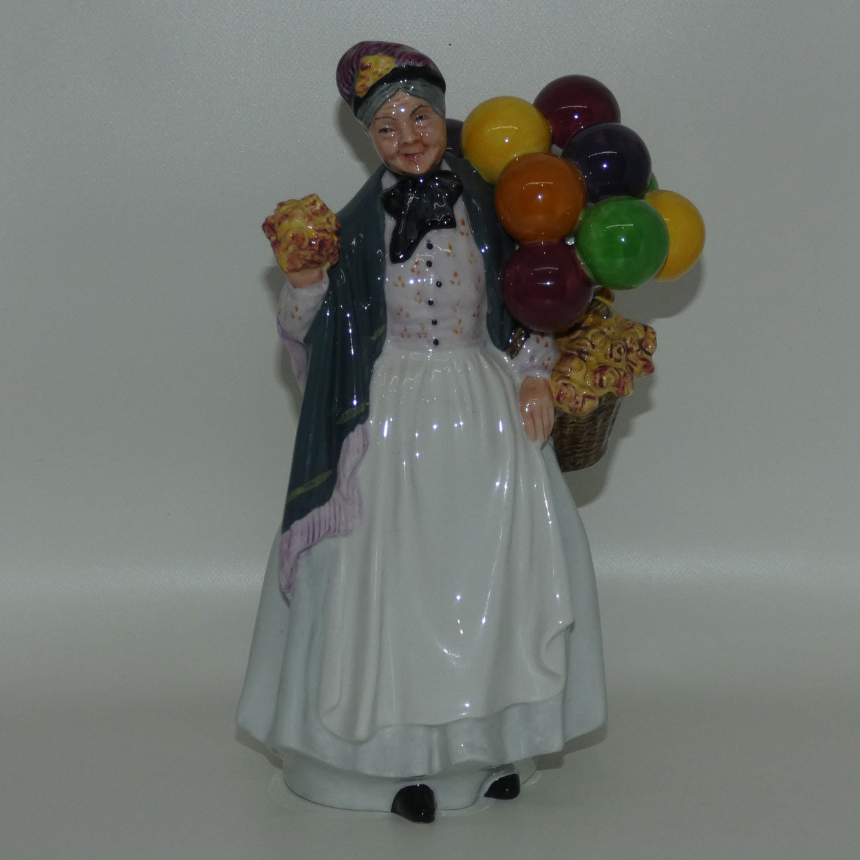 HN1843 Royal Doulton figure Biddy Penny Farthing | later stamp