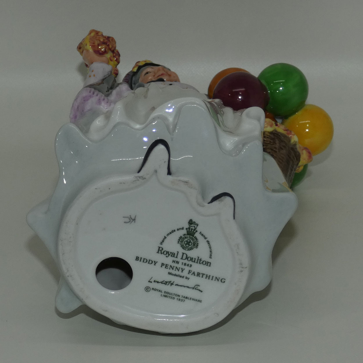 HN1843 Royal Doulton figure Biddy Penny Farthing | later stamp