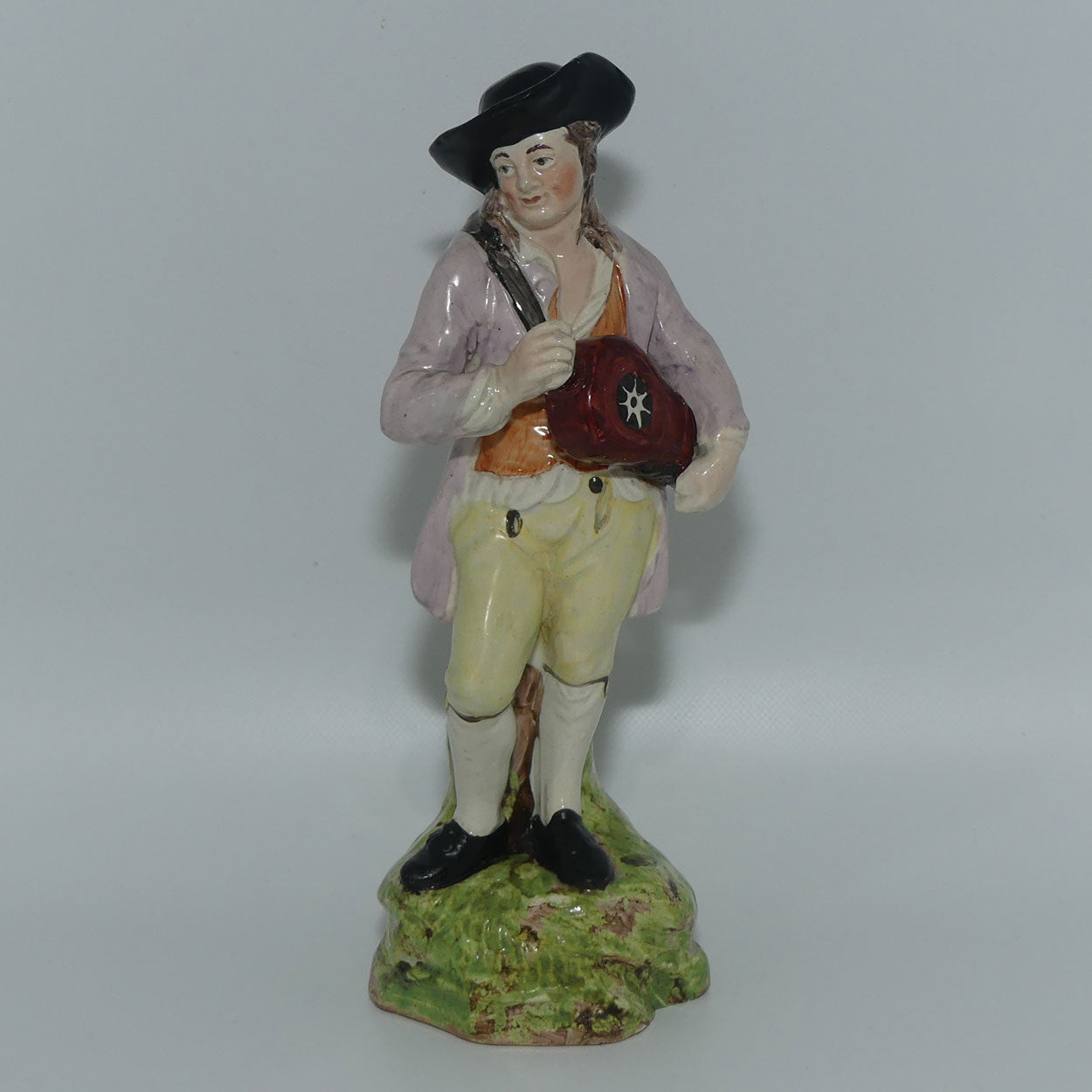 19th Cent English Pottery Man in Hat Carrying Instrument