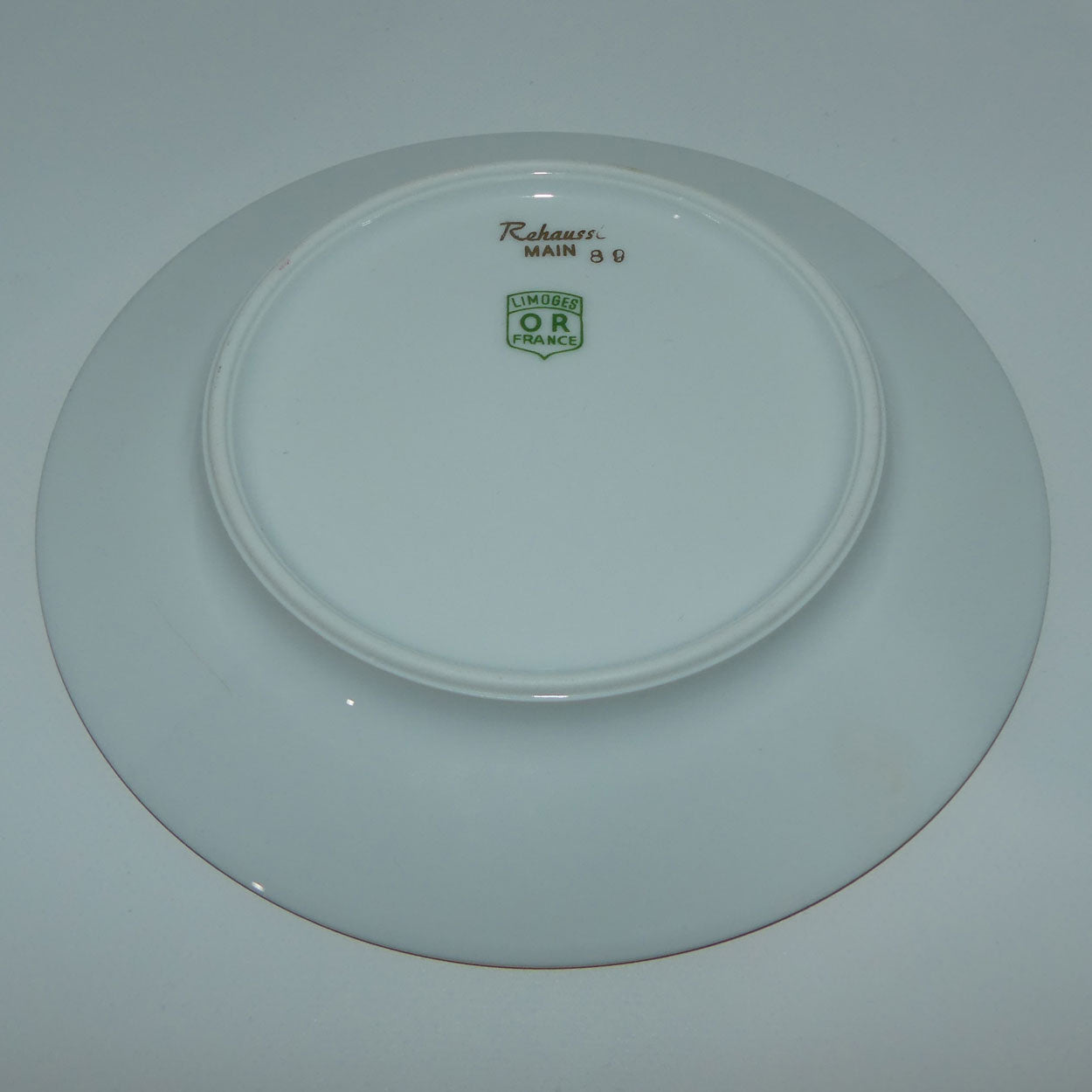 rehausst-main-limoges-or-france-courting-plate-rouge-16cm