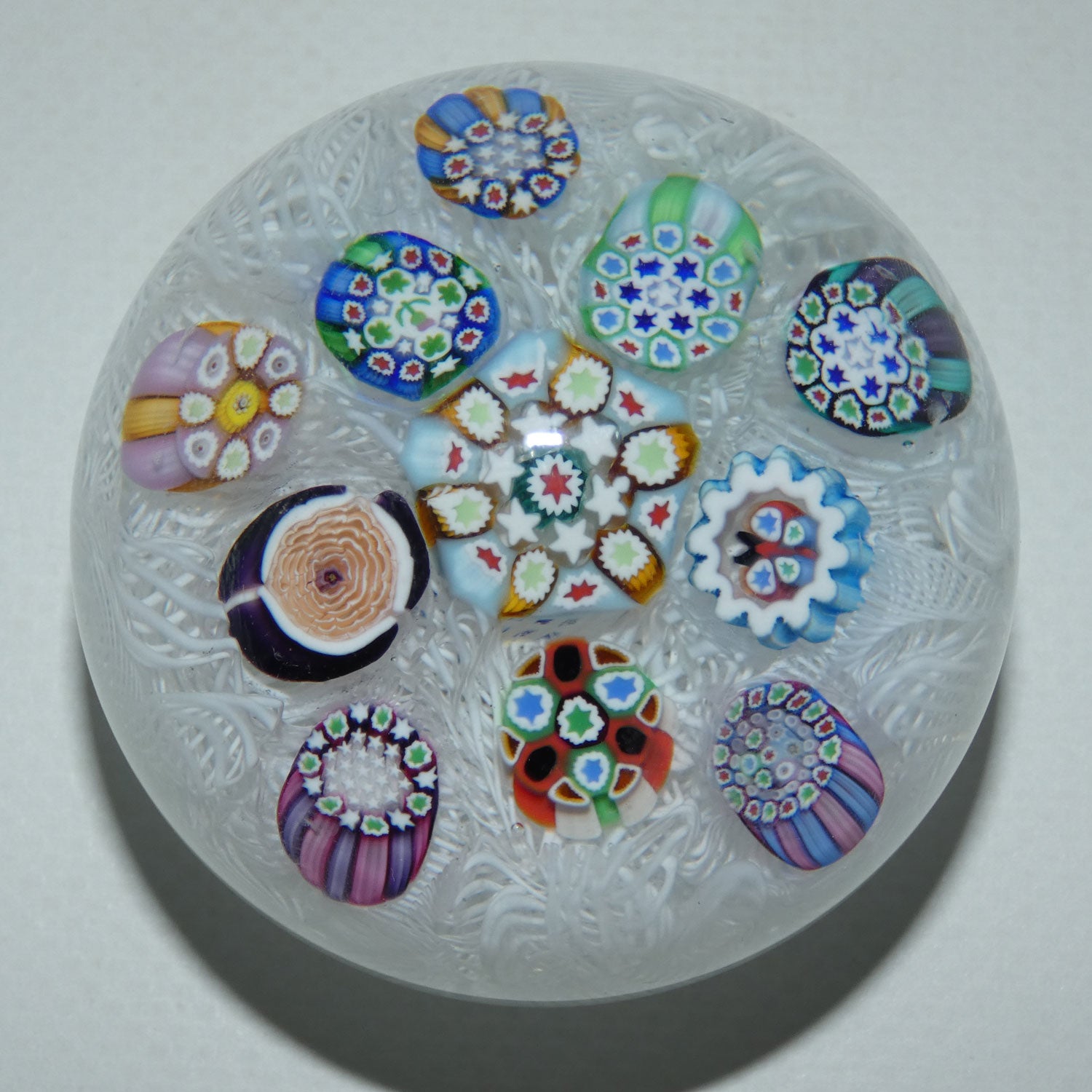 john-deacons-scotland-scattered-millefiori-on-white-lace-medium-paperweight