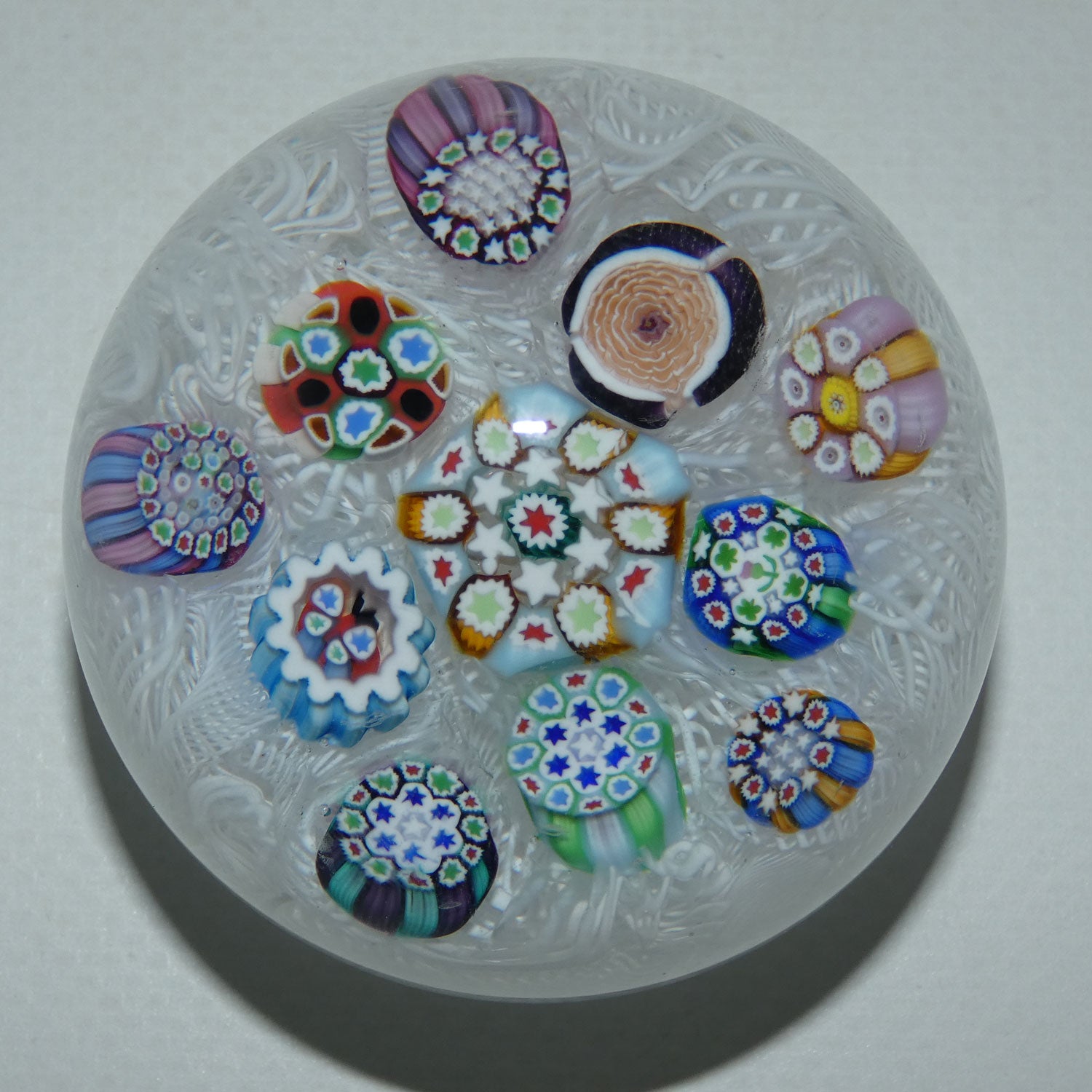 john-deacons-scotland-scattered-millefiori-on-white-lace-medium-paperweight