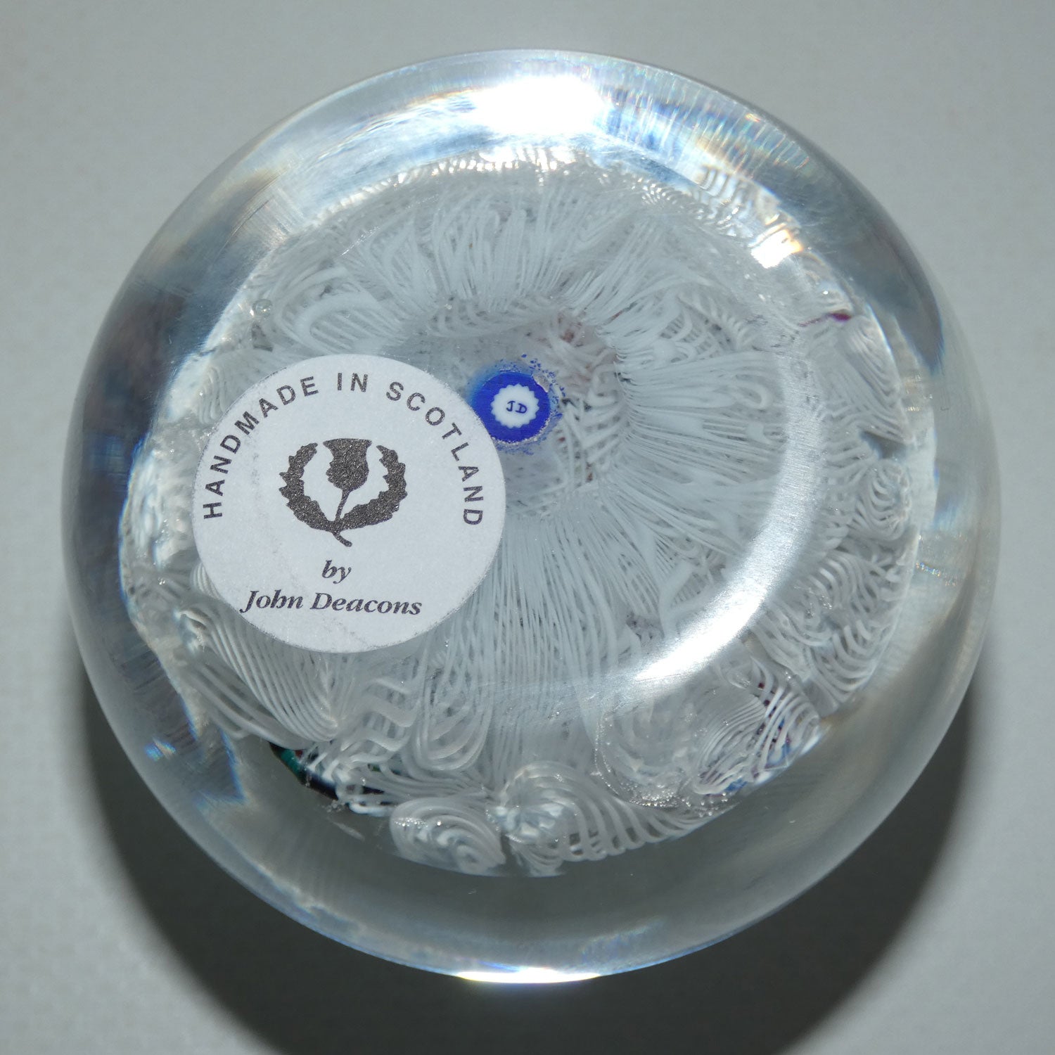 john-deacons-scotland-scattered-millefiori-on-white-lace-medium-paperweight