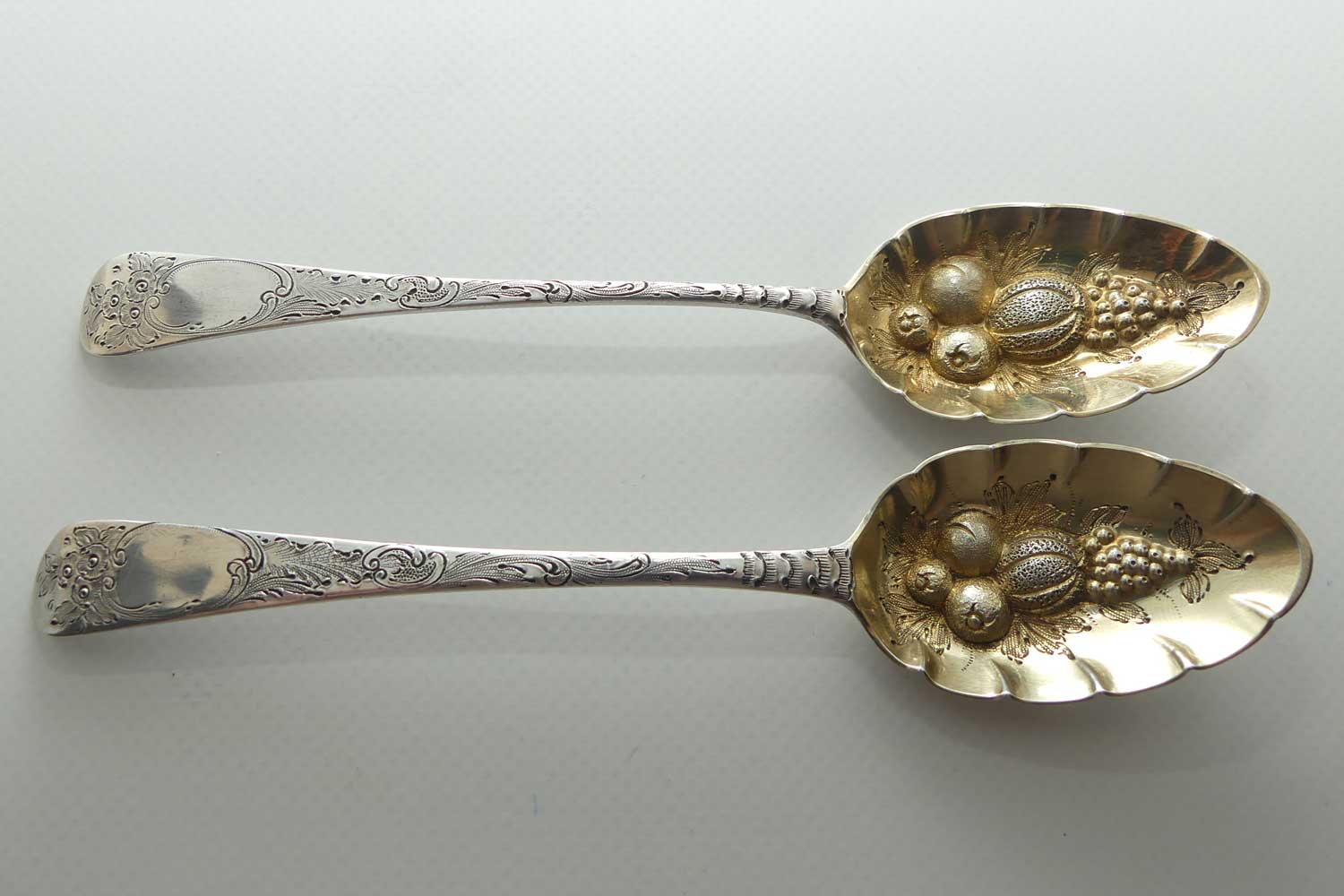 Pair Georgian era GeoIII Sterling Silver berry spoons with gilt wash bowls | London 1791 and 1795 | different makers