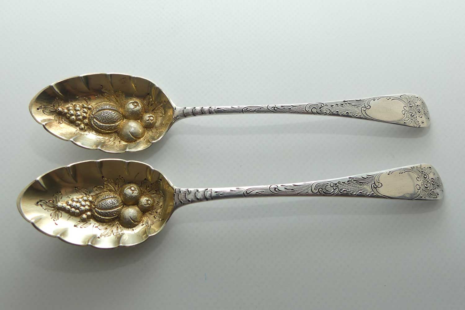 Pair Georgian era GeoIII Sterling Silver berry spoons with gilt wash bowls | London 1791 and 1795 | different makers