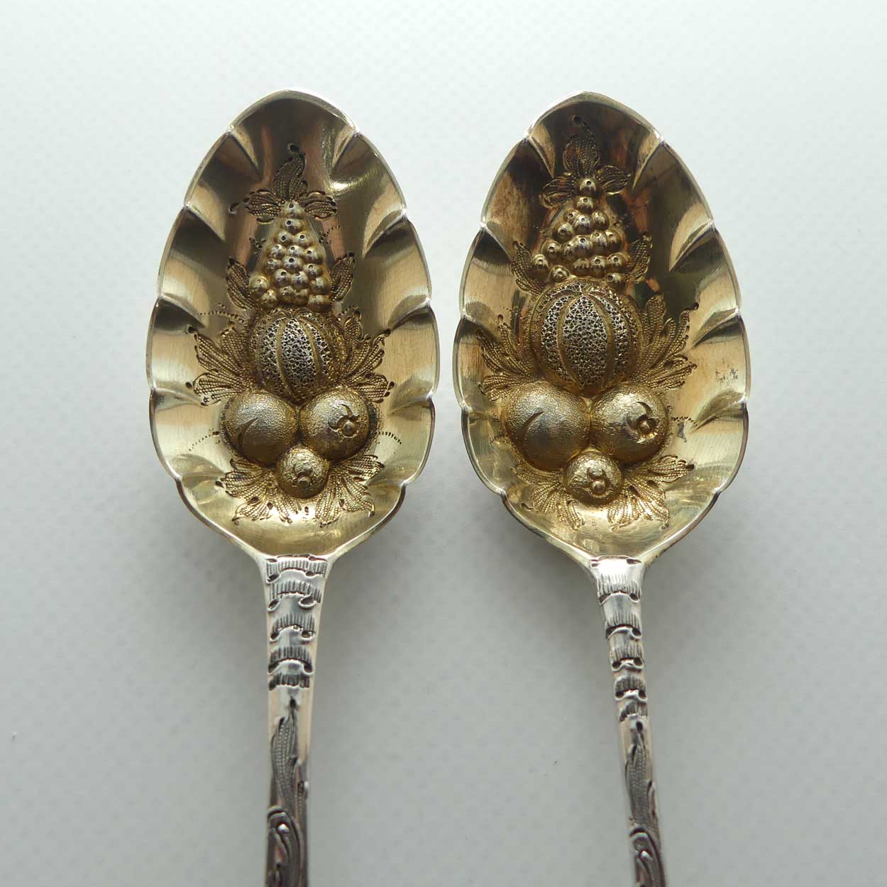 Pair Georgian era GeoIII Sterling Silver berry spoons with gilt wash bowls | London 1791 and 1795 | different makers