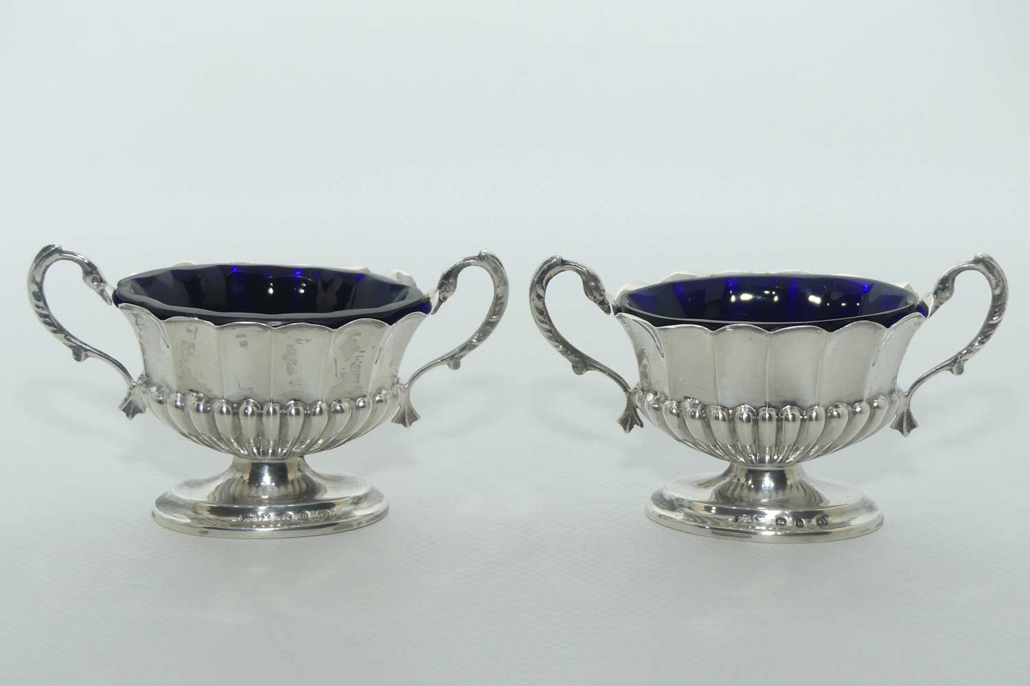 Victorian era Sterling Silver open salts in Campagna vase form with blue glass liners | Birmingham 1876