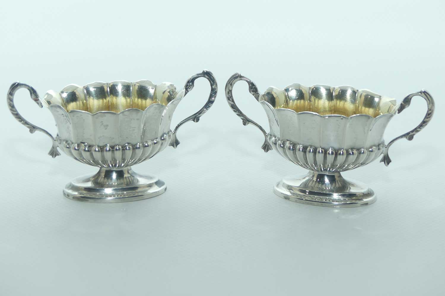 Victorian era Sterling Silver open salts in Campagna vase form with blue glass liners | Birmingham 1876