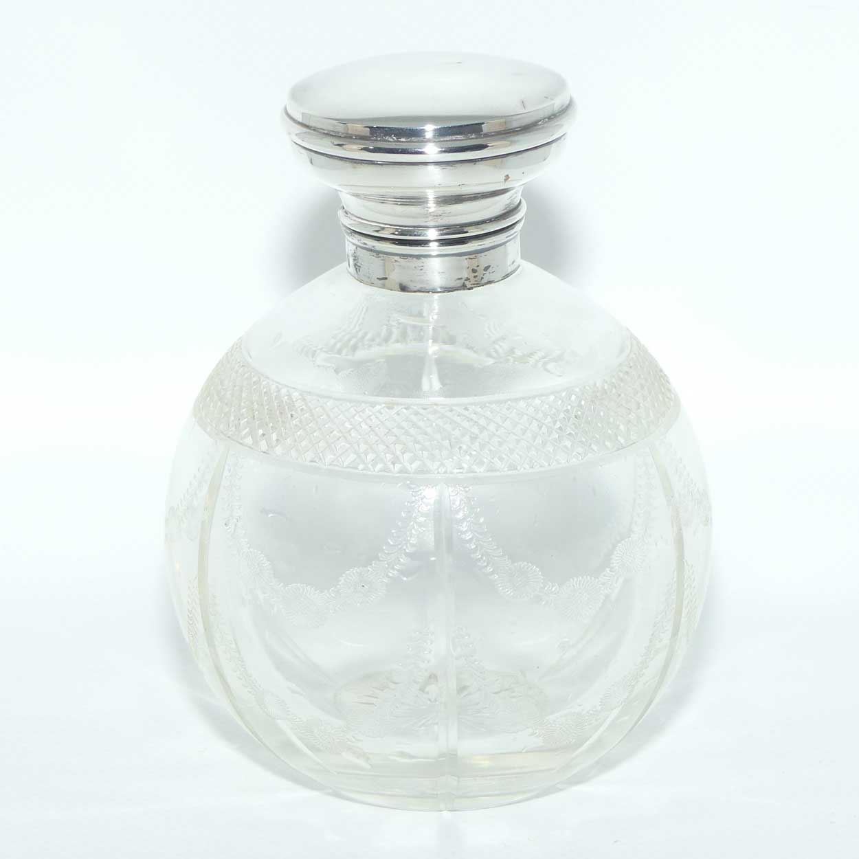 Edwardian era Sterling Silver and cut crystal perfume bottle with fine garlands of flowers decoration