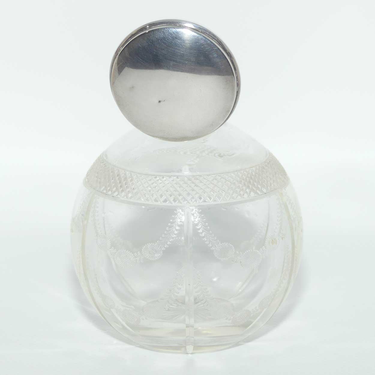 Edwardian era Sterling Silver and cut crystal perfume bottle with fine garlands of flowers decoration