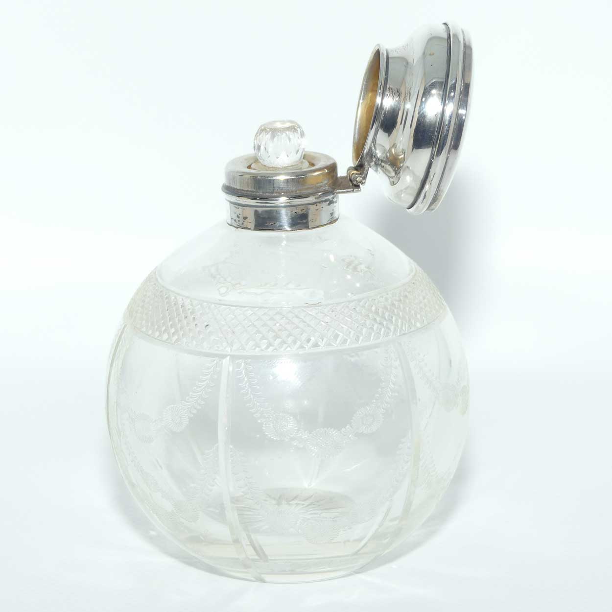 Edwardian era Sterling Silver and cut crystal perfume bottle with fine garlands of flowers decoration