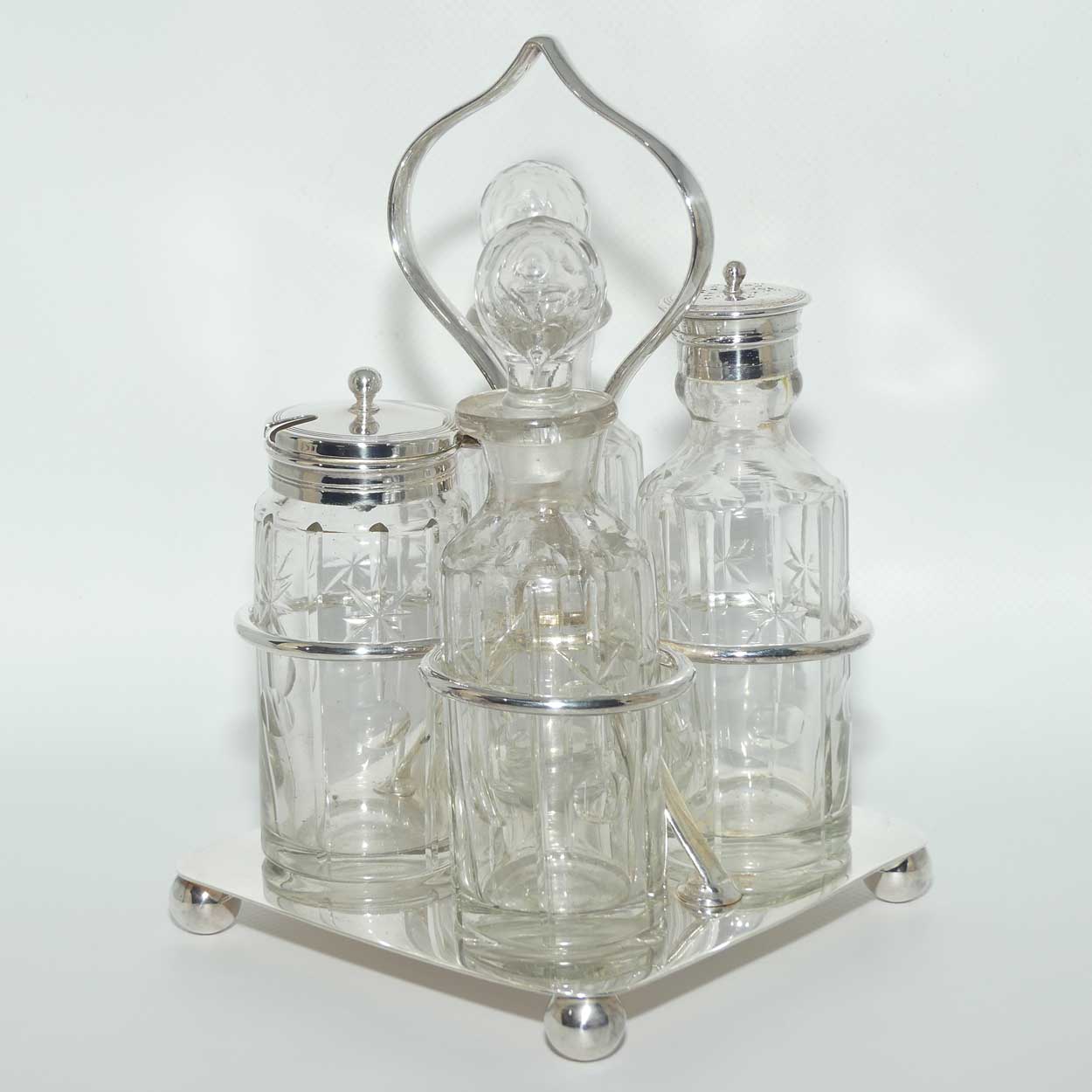 Nice quality Edwardian era 4 bottle cruet set on Silverplated stand | Finely cut bottles