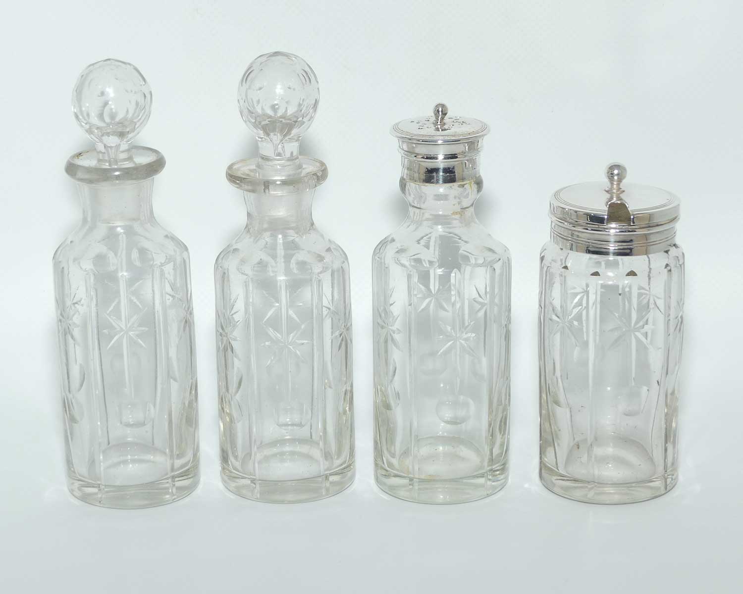 Nice quality Edwardian era 4 bottle cruet set on Silverplated stand | Finely cut bottles