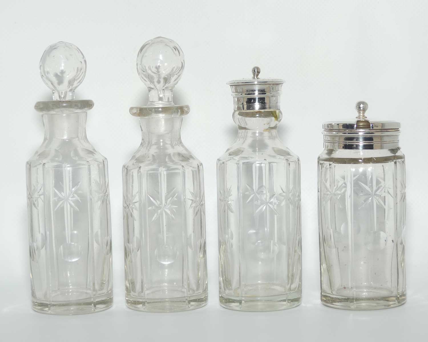 Nice quality Edwardian era 4 bottle cruet set on Silverplated stand | Finely cut bottles