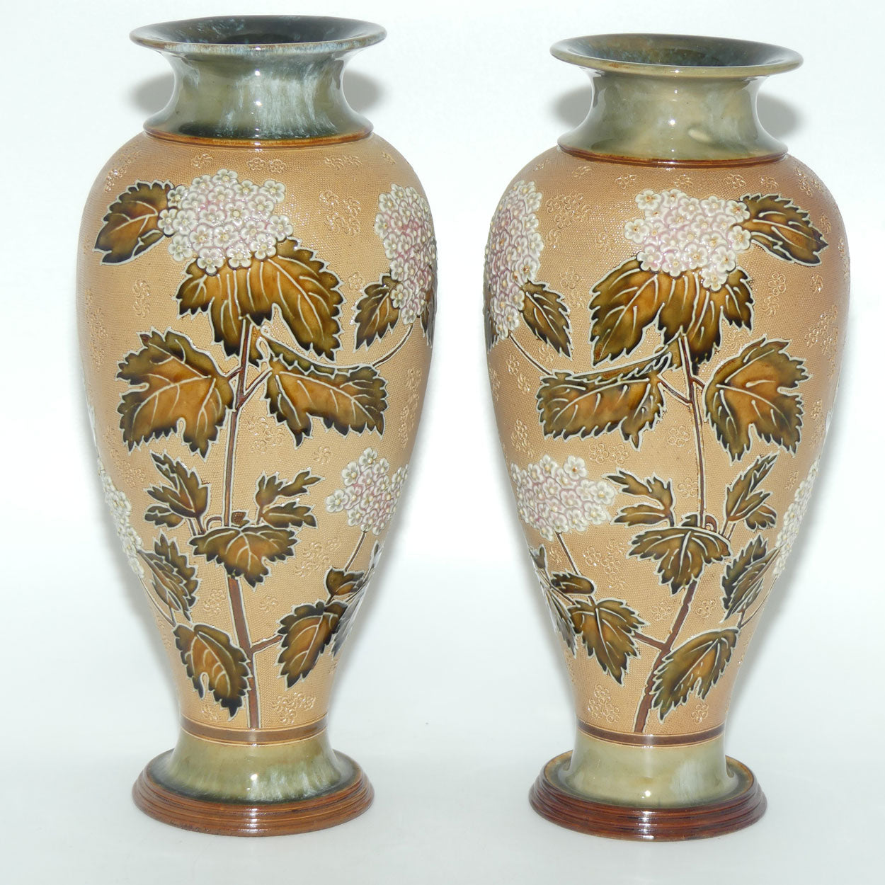 Doulton Slaters pair of stoneware foliage and flowers vases (stamped 6482)
