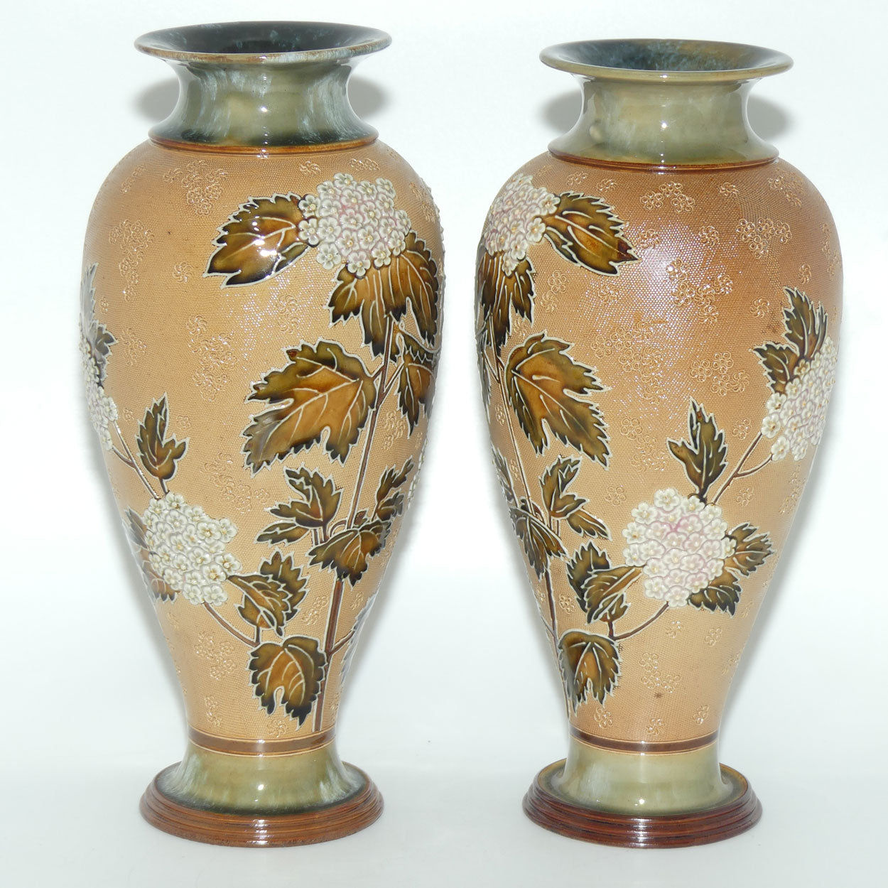 Doulton Slaters pair of stoneware foliage and flowers vases (stamped 6482)