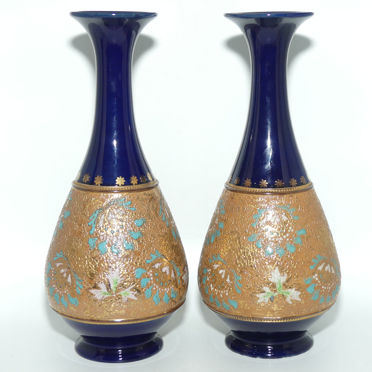 Doulton Slaters stoneware pair of narrowneck bulbous vases with blue, white & green enamelling and gilt highlights (stamped 672)