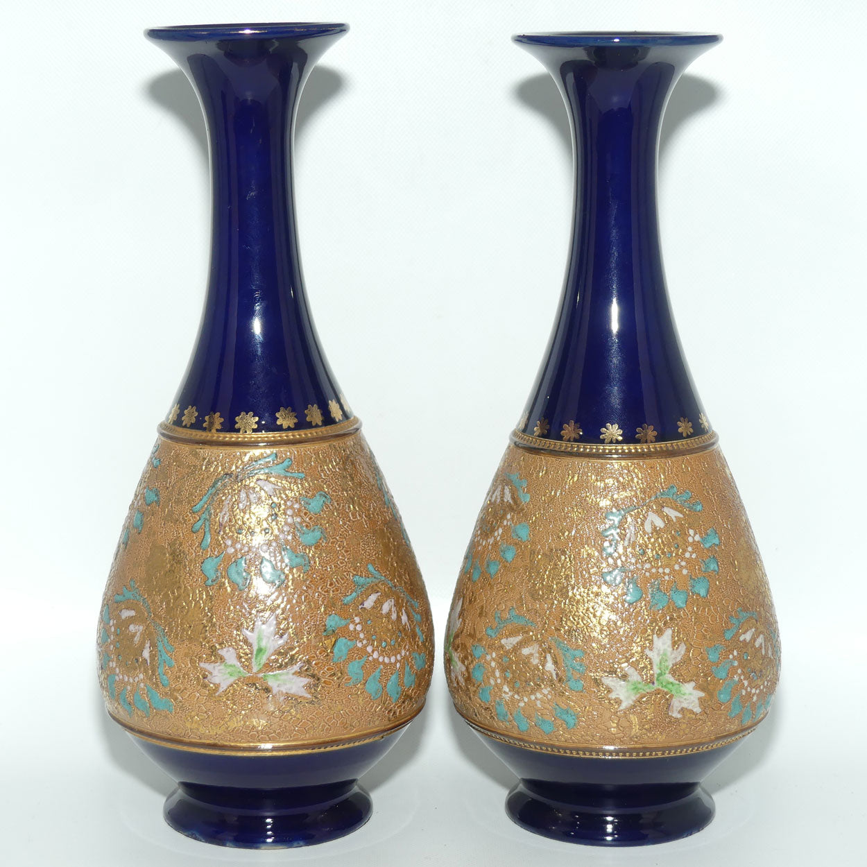 Doulton Slaters stoneware pair of narrowneck bulbous vases with blue, white & green enamelling and gilt highlights (stamped 672)