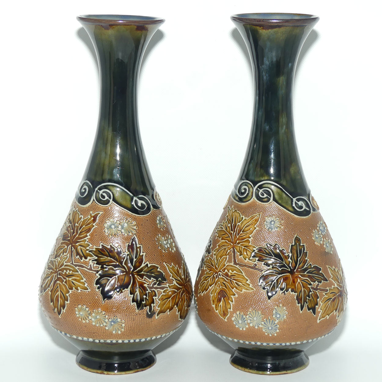 Royal Doulton pair of stoneware vases with applied foliage and scrolling (stamped 6767)