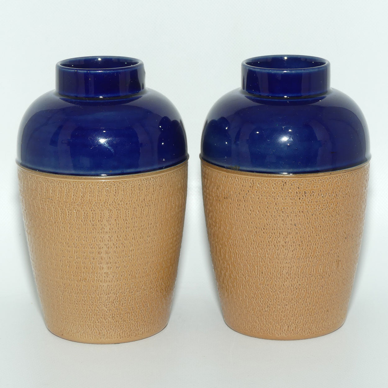 Royal Doulton pair of small stoneware vases with stippled finish | Blue tops | 7360