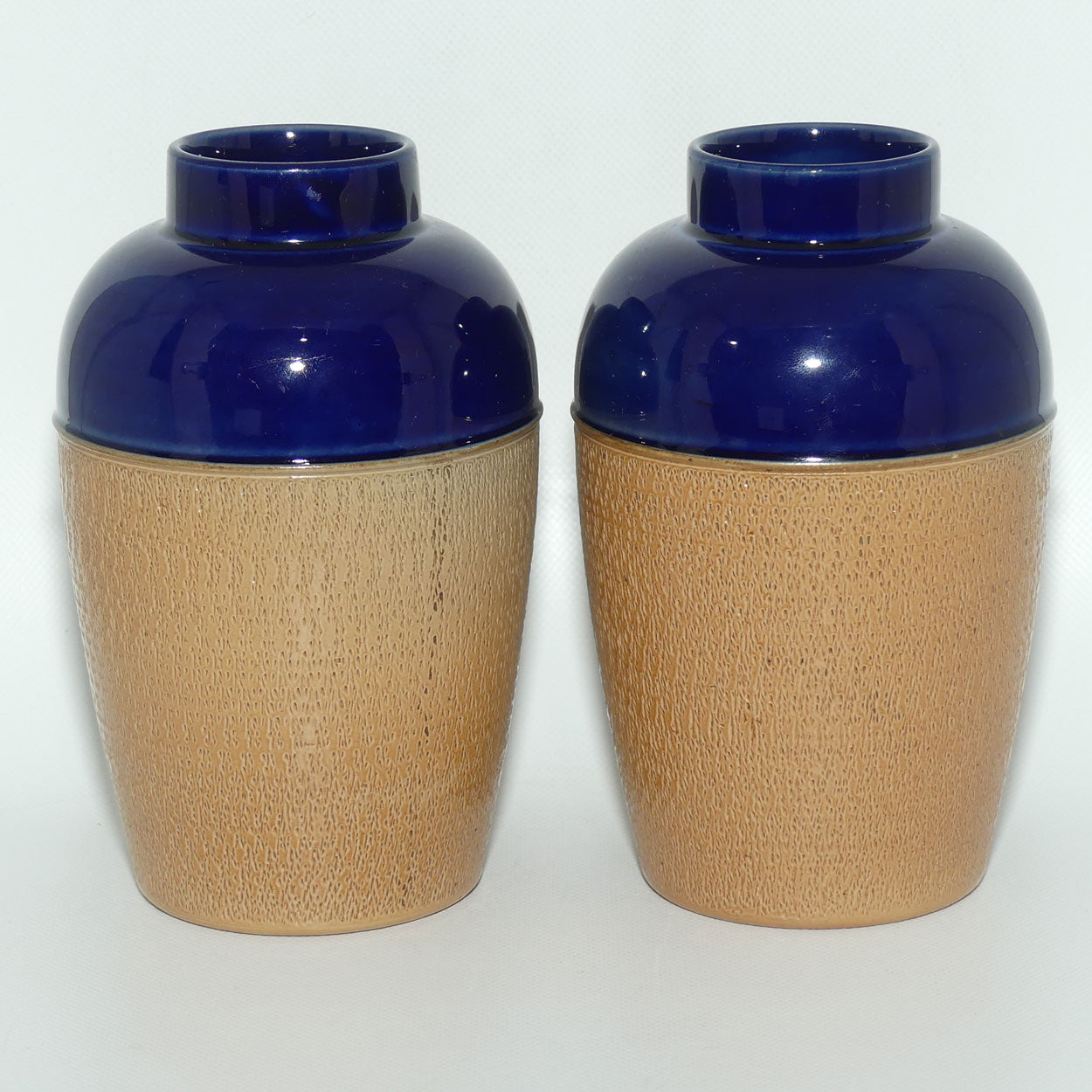Royal Doulton pair of small stoneware vases with stippled finish | Blue tops | 7360