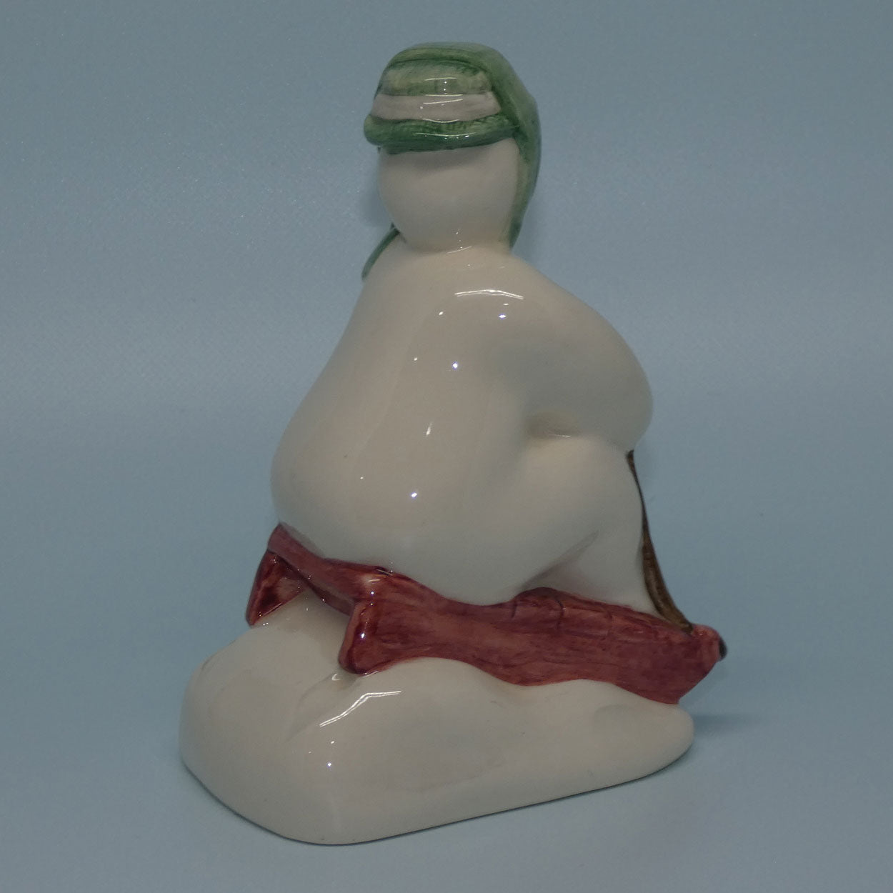 ds20-royal-doulton-snowman-figure-the-snowman-toboganning