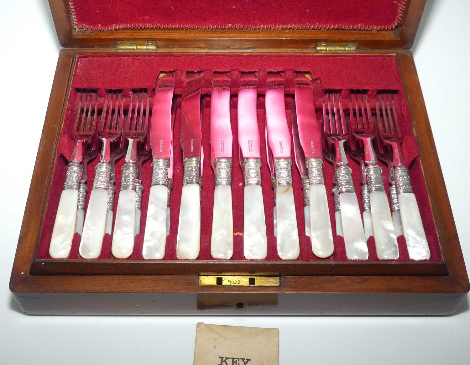 Late Victorian era Solid Mother of Pearl handles and EPNS blades set of 12 fruit set in Walnut canteen