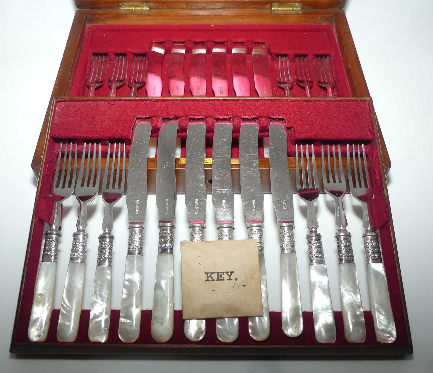 Late Victorian era Solid Mother of Pearl handles and EPNS blades set of 12 fruit set in Walnut canteen