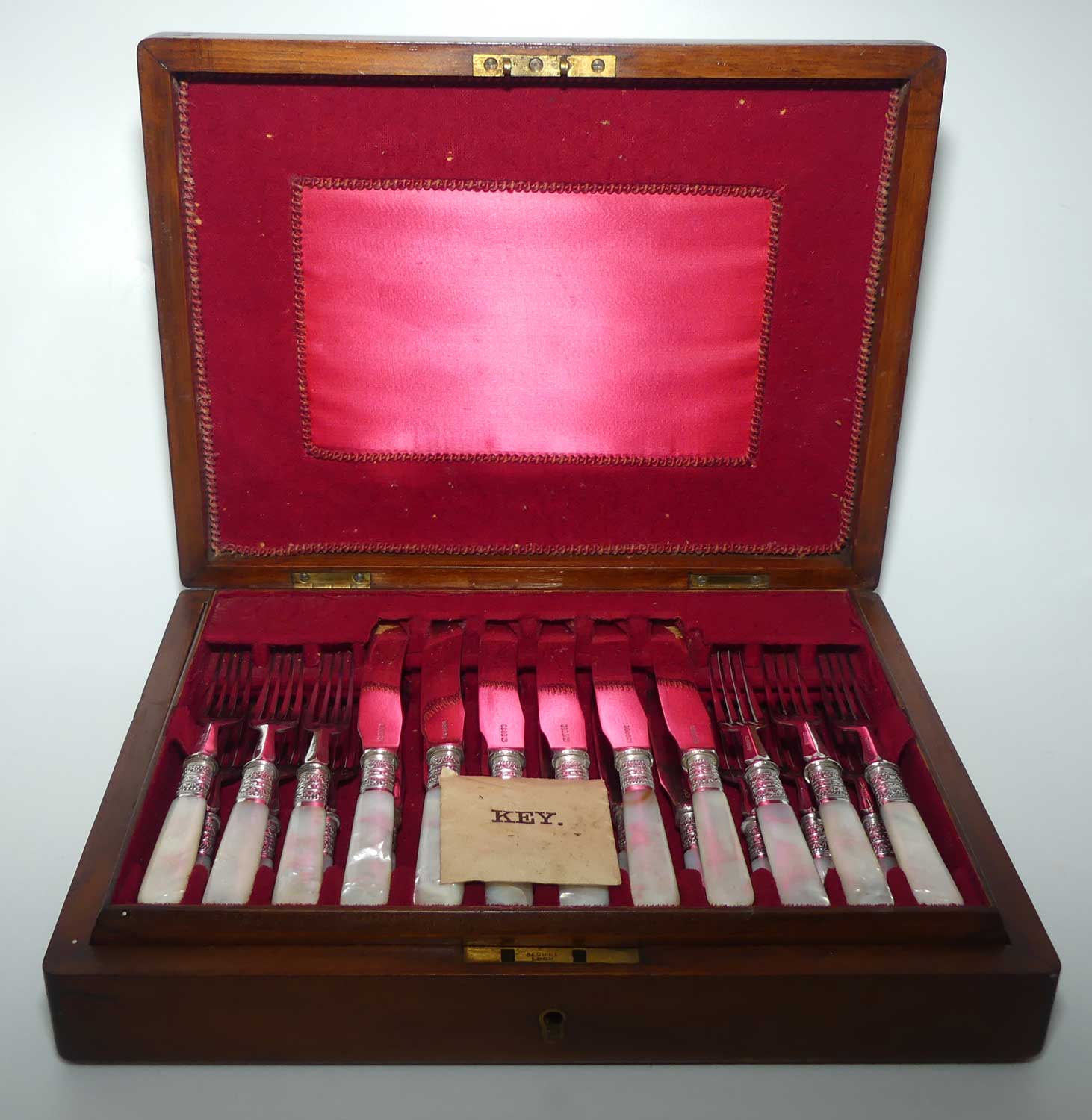 Late Victorian era Solid Mother of Pearl handles and EPNS blades set of 12 fruit set in Walnut canteen