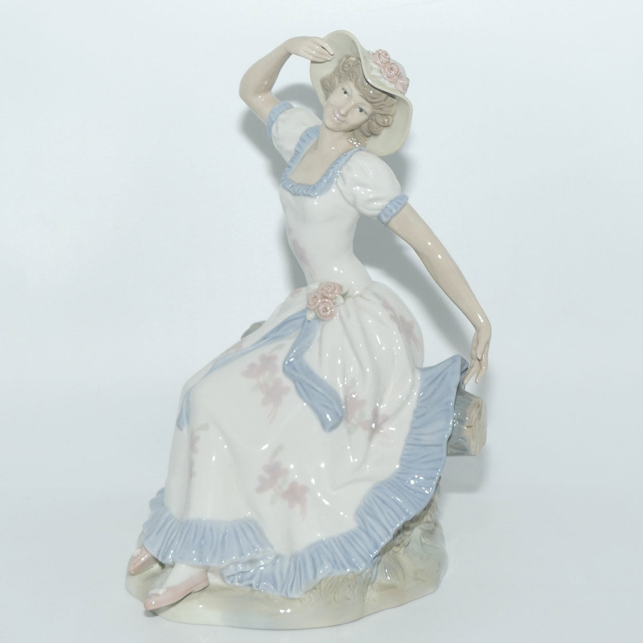 Zaphir | Nao | Lladro figure of a Seated Lady in Sun Hat